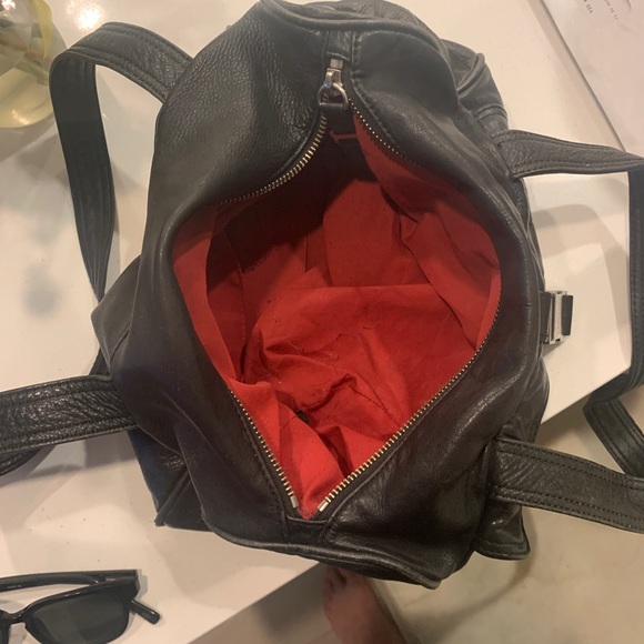 Black leather Kenneth Cole bag with red lining and silver hardware. - Picture 3 of 4